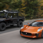 A black offroading SUV, a black sporty SUV and an orange super car from JLR Special Vehicle Operations are pictured driving.