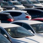 A used car lot is shown at a used car dealership.