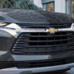 A close up of a black 2022 Chevy Blazer shows the front grille and headlights at a Chevy Blazer dealer.