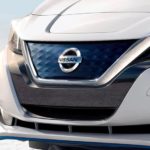 A close up shows the V-Motion grille on a white 2022 Nissan LEAF.