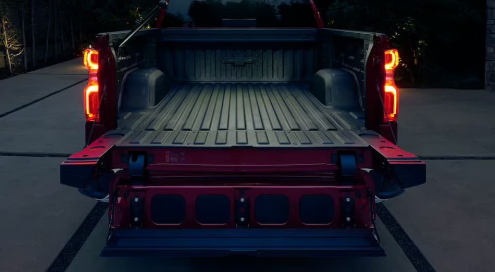 The truck bed of a red 2023 Chevy Silverado 1500 is shown.