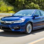 A blue 2017 Honda Accord is shown driving on a highway after visiting a used Honda Accord for sale.