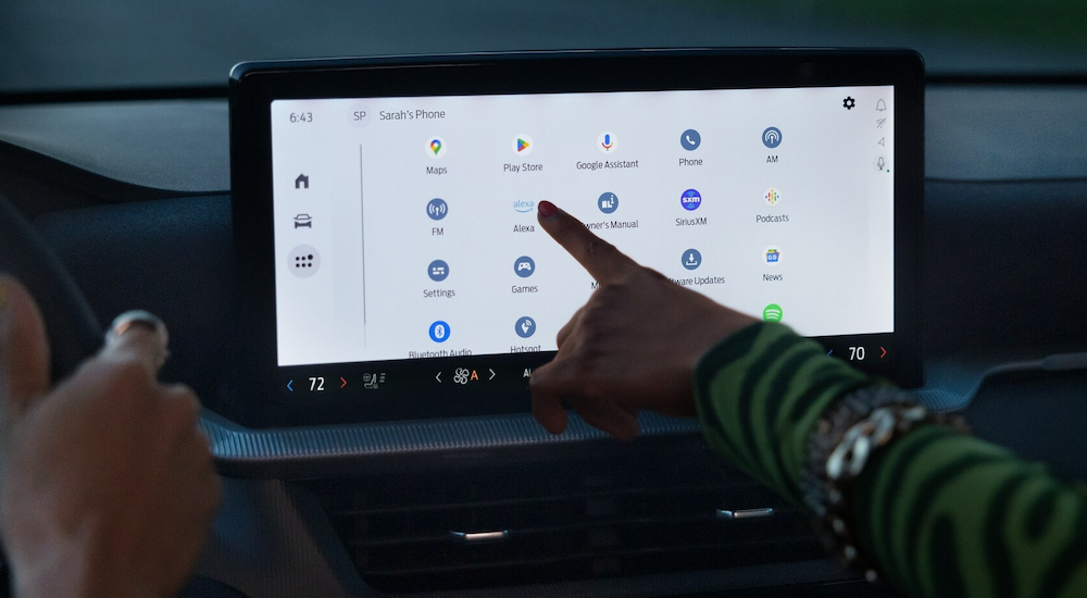 A close-up of the Ford Digital Experience infotainment screen in a 2025 Ford Explorer at a Ford dealer.