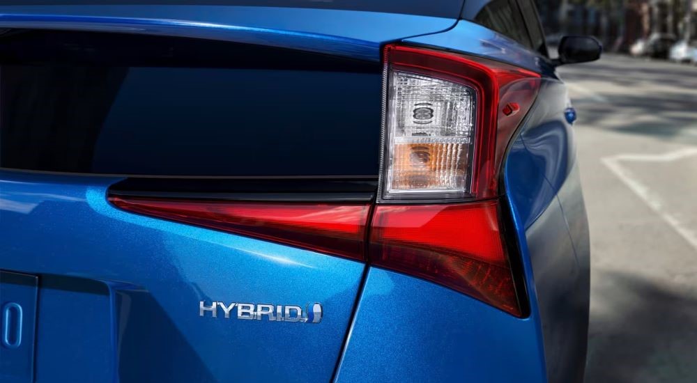 A blue 2021 Toyota Prius is shown after looking for used cars for sale.