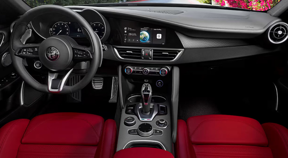 Red upholstery in the cabin of a 2024 Alfa Romeo Giulia.