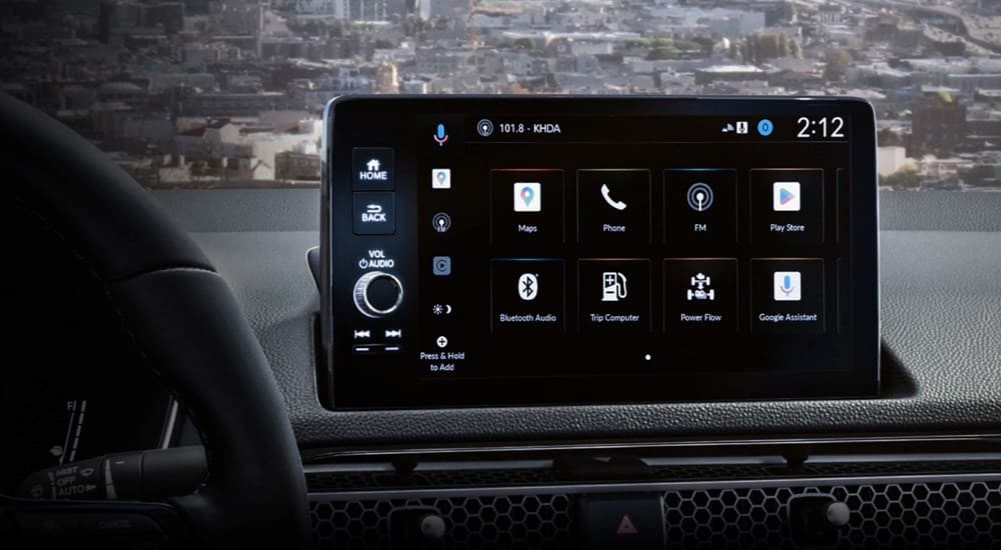 A close-up of an infotainment screen in a 2025 Honda Civic Hybrid is shown.