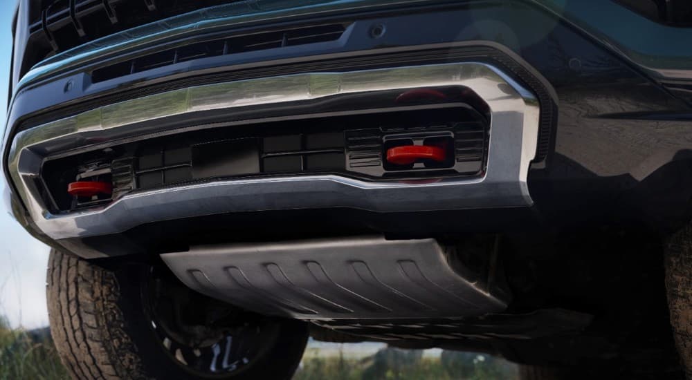 A close-up of the red recovery hooks on the front of a 2024 Chevy Tahoe Z71.