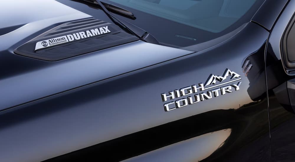 The Allison Transmission and Duramax badge on a black 2024 Chevy Silverado 2500 HD High Country.