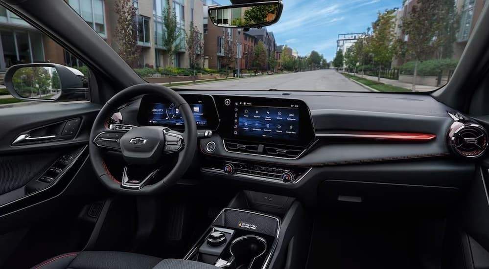 The black interior and dash in a 2025 Chevy Equinox is shown.