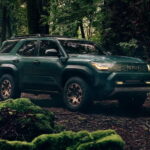 A green 2025 Toyota 4Runner is shown from the side after leaving a Toyota dealer.