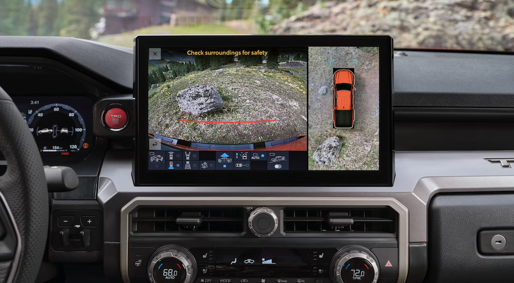 The 360-degree camera view on the infotainment screen of a 2024 Toyota Tacoma TRD Hybrid for sale.