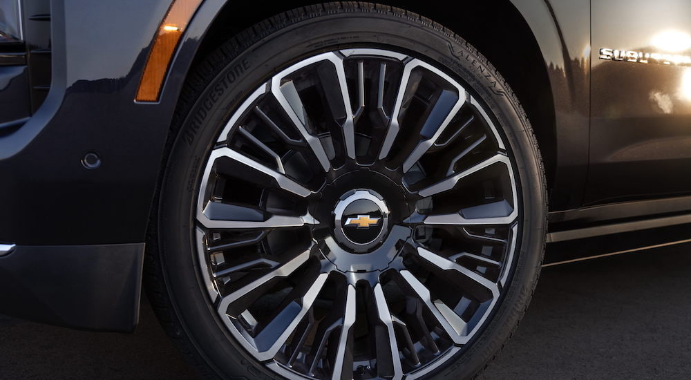 The wheel of a 2025 Chevy Suburban High Country is shown in close-up.