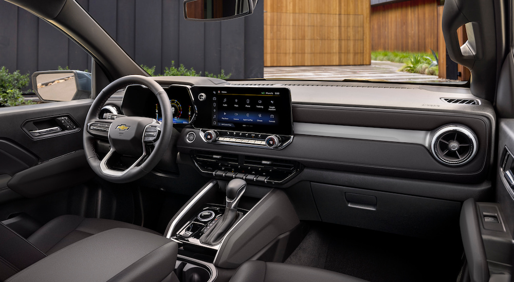 The steering wheel and dashboard in a 2024 Chevy Colorado LT for sale.