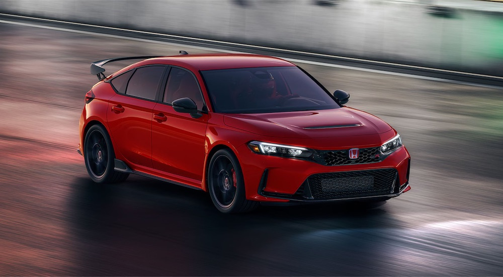 A red 2024 Honda Civic Type R is shown from the front at an angle.