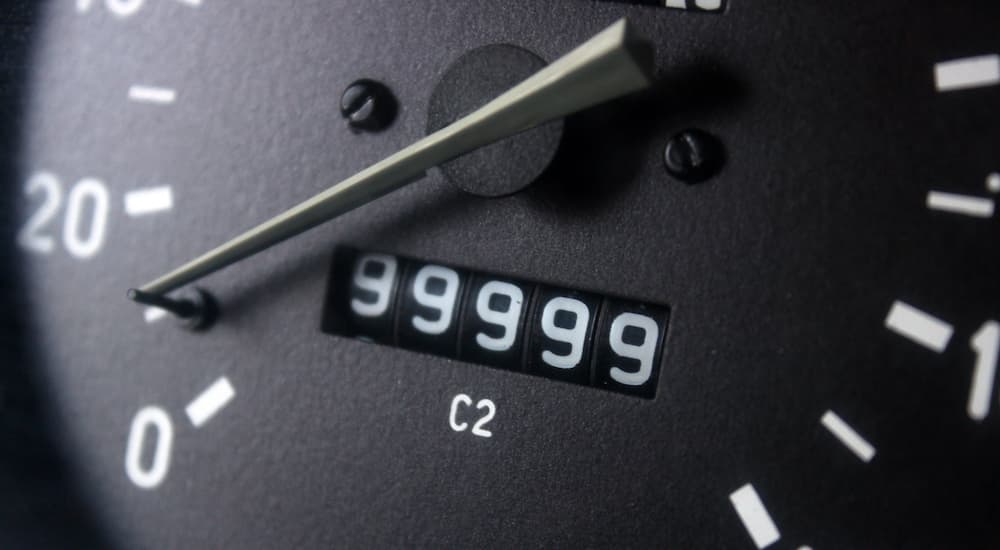 An odometer reading out 99,999 is shown.