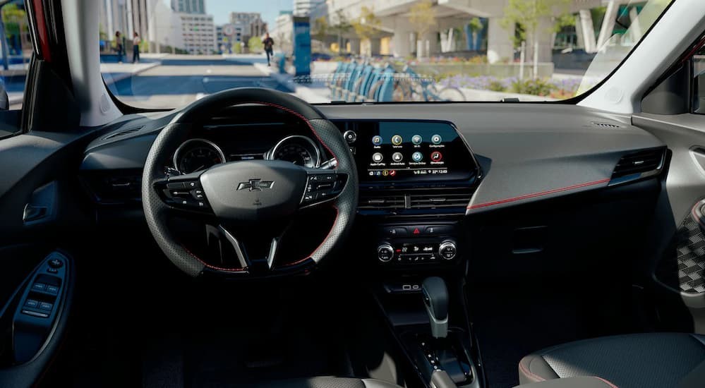 The black interior and dash in a 2023 Chevy Montana RS is shown.