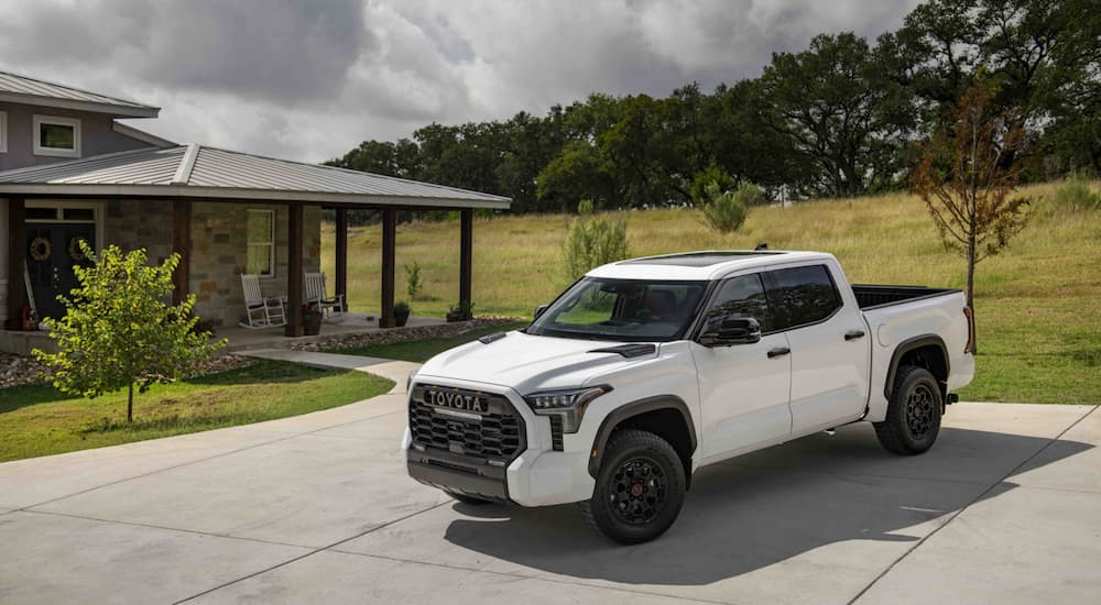 A white 2024 Toyota Tundra TRD Pro parked on a driveway.