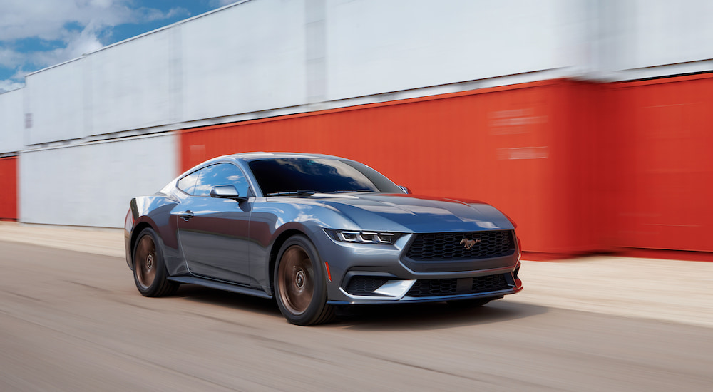 A blue 2024 Ford Mustang Ecoboost is shown from the front at an angle.