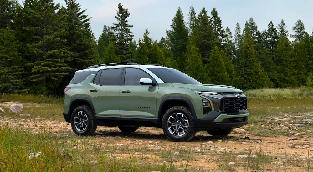 A green 2025 Chevy Equinox ACTIV is shown from the side after leaving a Chevy dealer.