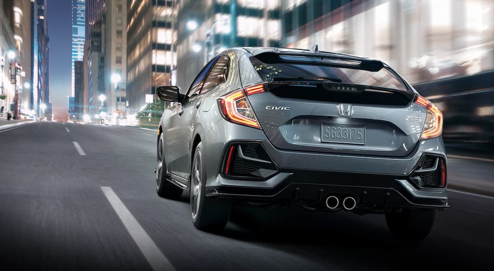 A grey 2020 Honda Civic Hatchback Sport Touring is shown from the rear.