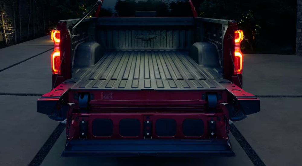 The Multiflex tailgate on a red 2024 Chevy Silverado 1500 is shown.