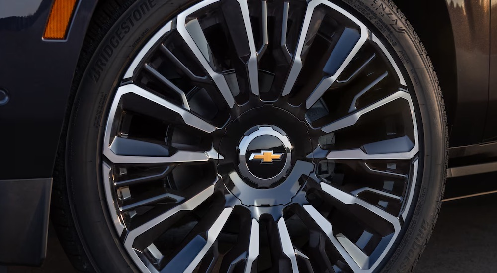 The wheel of a 2025 Chevy Tahoe for sale is shown in close-up.