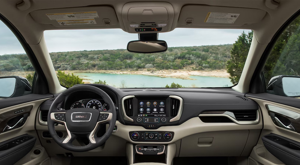 The steering wheel and dashboard in a 2024 GMC Terrain Denali for sale.