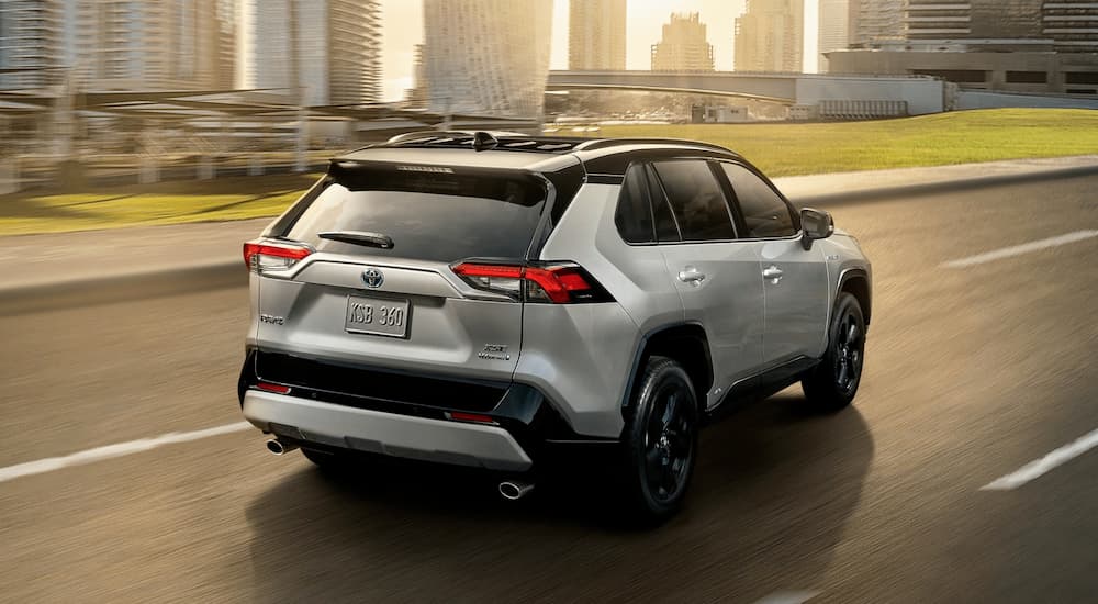 A silver 2020 Toyota RAV4 XSE is shown from the rear at an angle.