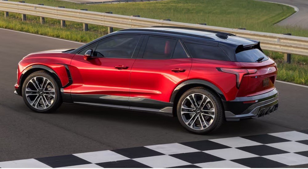 A red 2025 Chevy Blazer RS EV is shown parked near a finish line.