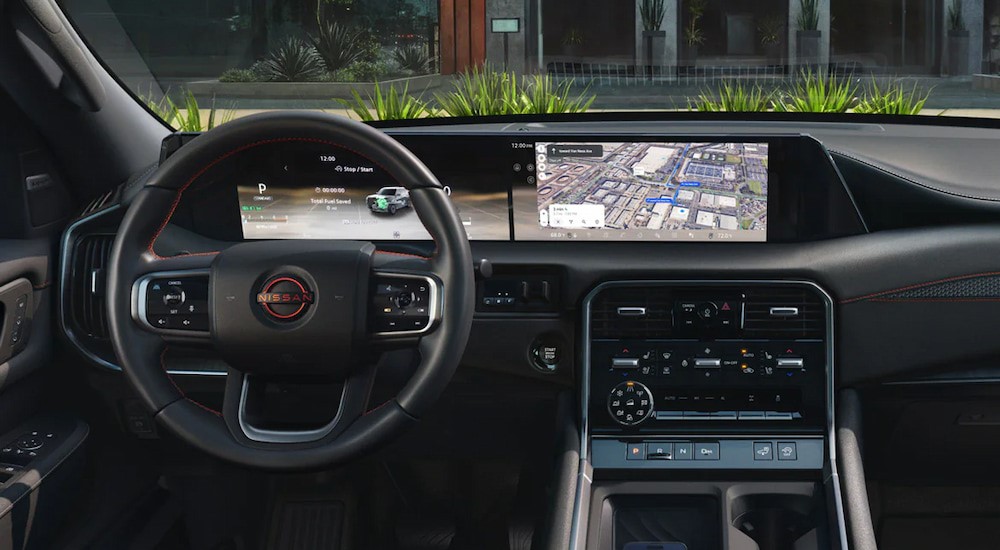 The black interior and dash is shown in a 2025 Nissan Armada PRO-4X.