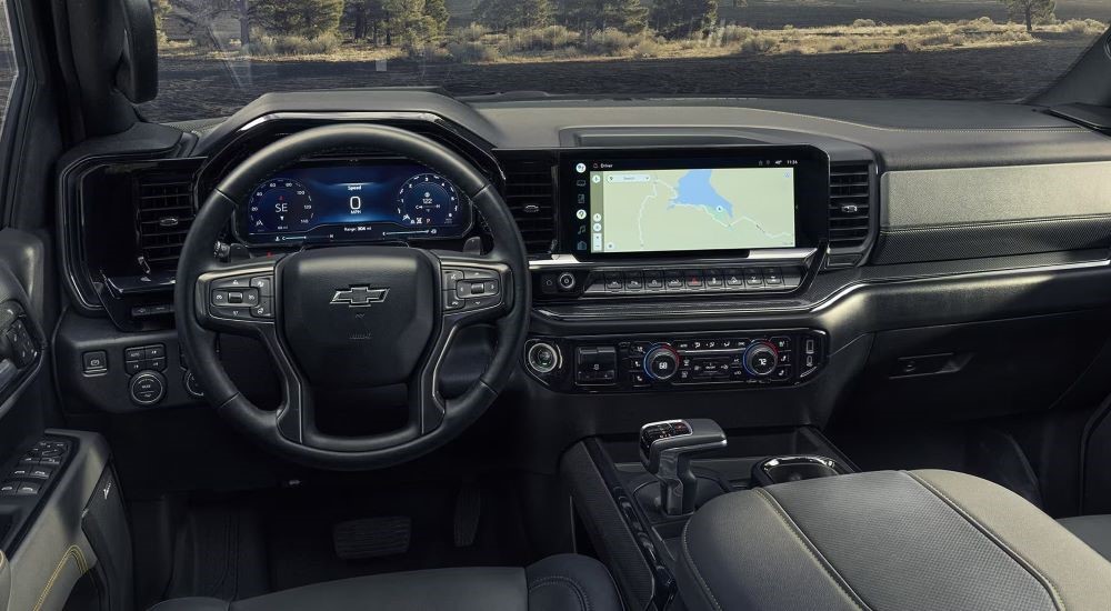 The black interior and dash are shown in a 2022 Chevy Silverado 1500.