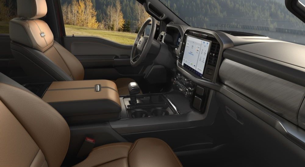 The black and brown interior and dash is shown in a 2024 Ford F-150 Platinum.