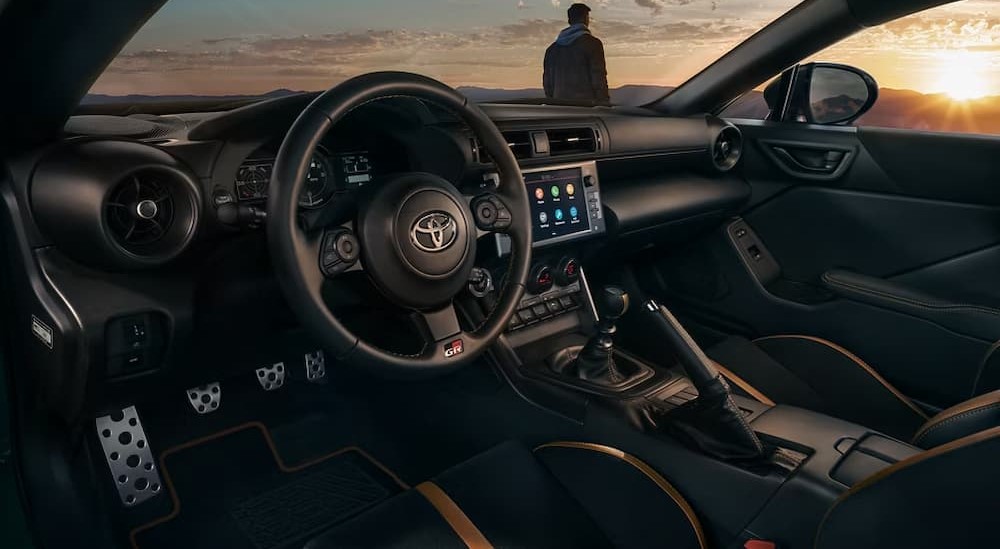 The black interior and dash are shown in a 2025 Toyota GR86 Hakone Edition.