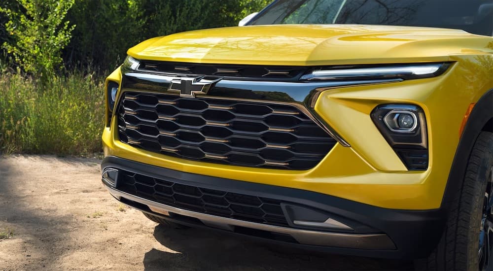 Close-up on the grille of a yellow 2025 Chevy Trailblazer ACTIV.