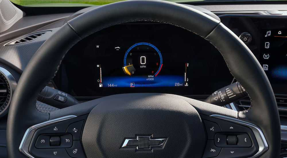 Close-up of the steering wheel and Driver Information Center in a 2025 Chevy Trax for sale.