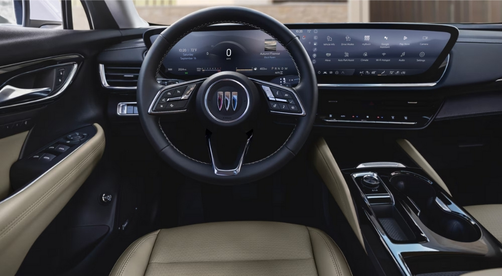 The steering wheel and infotainment screen in a 2024 Buick Envision.