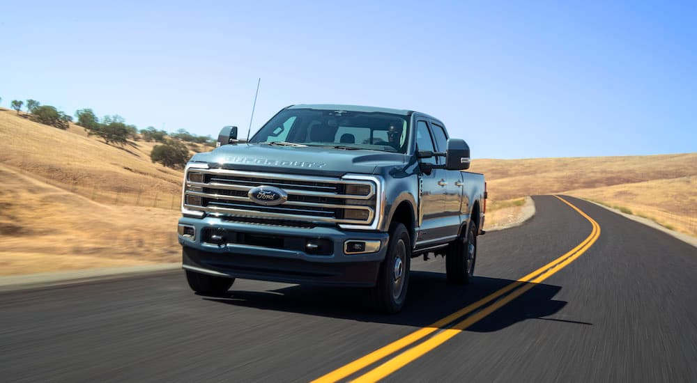 A teal 2025 Ford F-350 is shown from the front at an angle.