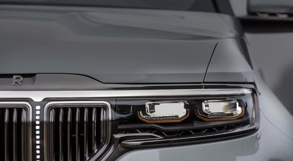 A close up shows the driver side headlight on a silver 2022 Jeep Wagoneer.