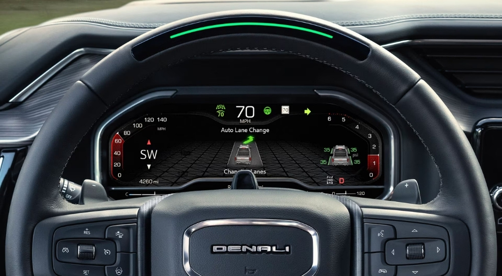 Close-up of the steering wheel and Super Cruise display in a 2025 GMC Sierra 1500 Denali.