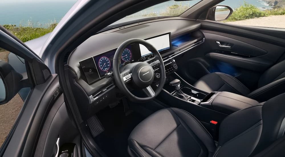 The black interior and dash are shown in a 2025 Hyundai Santa Cruz.