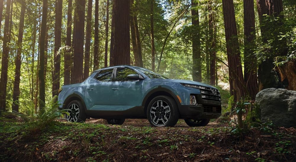 A blue 2025 Hyundai Santa Cruz Limited is shown parked off-road.