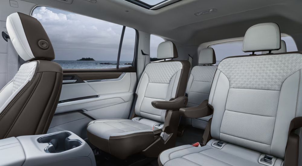 Captain's chairs and seating for five in the back of a 2025 GMC Acadia Denali.