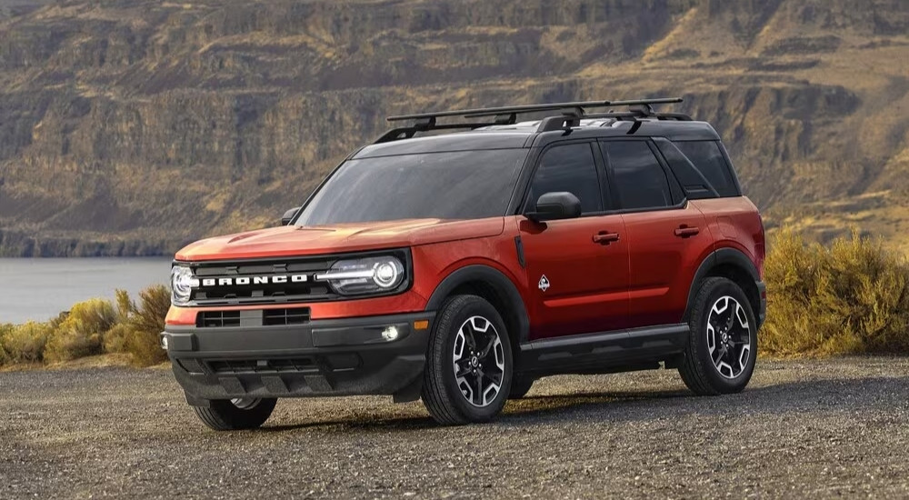 A red 2024 used Ford Bronco Sport for sale is shown from the front at an angle.