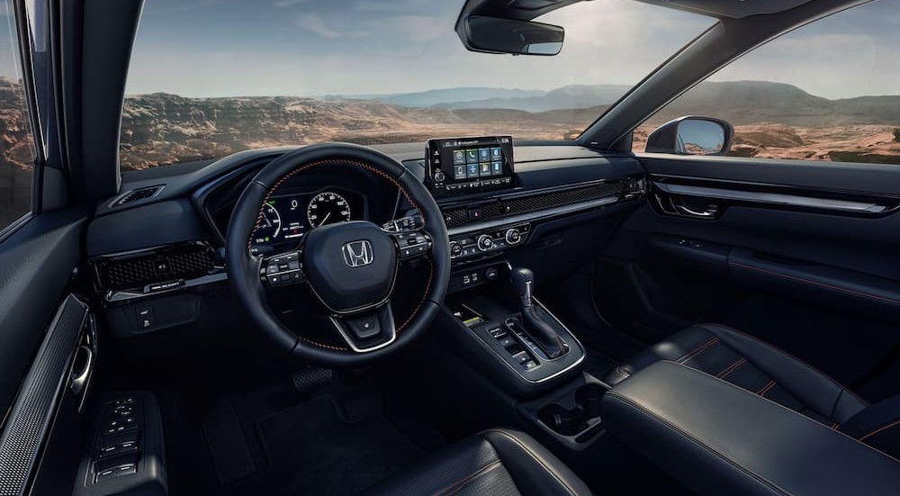 The black interior and dash are shown in a 2025 Honda CR-V Hybrid for sale.