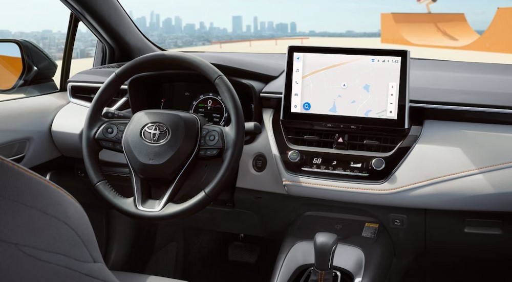 The gray interior and dash are shown in a 2025 Toyota Corolla FX.