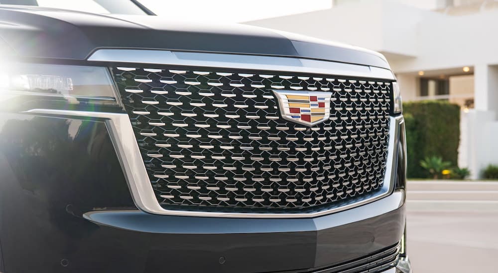 Close-up of the grille of a black 2021 Cadillac Escalade.