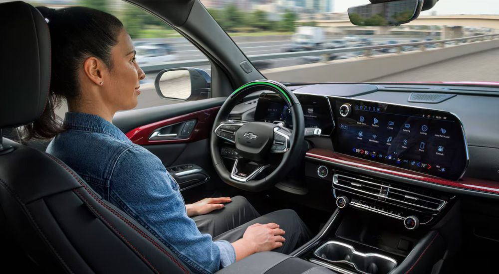 A woman using the Super Cruise feature in a 2025 Chevy Traverse.