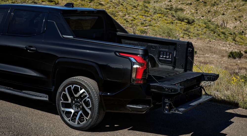 The open splitgate on a black 2025 Chevy Silverado EV.